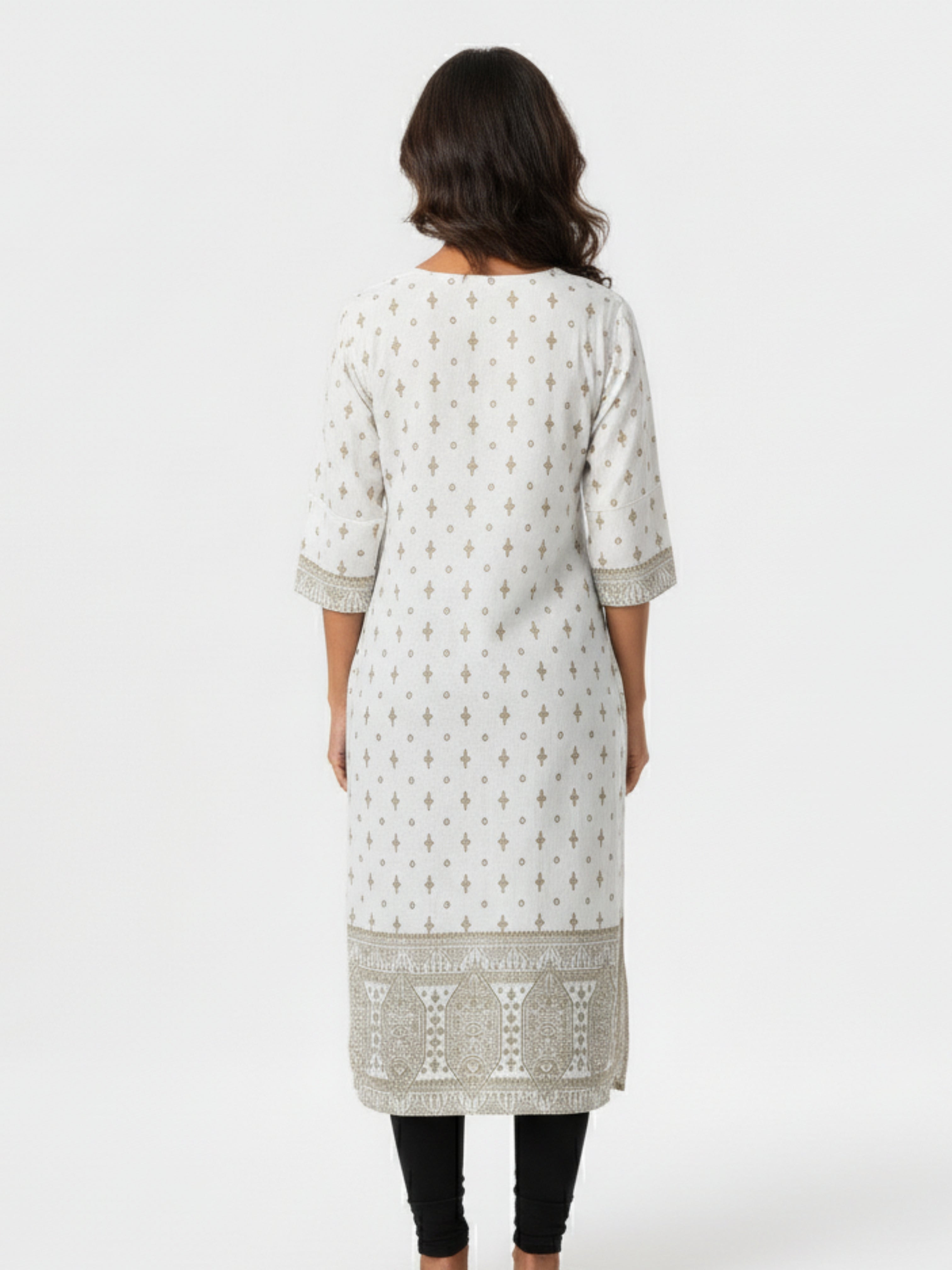 Woman wearing a light gray kurta with white patterns on a white background